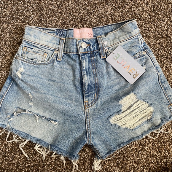 NWT Revice shorts with cut out. Run small so I would say fit more like a 25-26 - Picture 2 of 4